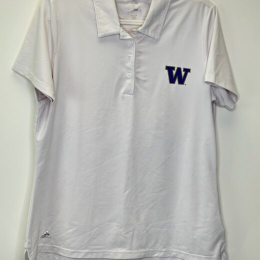 Front of white UW women’s Adidas golf polo with embroidered “W” logo