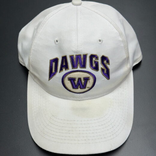 Front view of vintage white UW Huskies snapback with DAWGS embroidery
