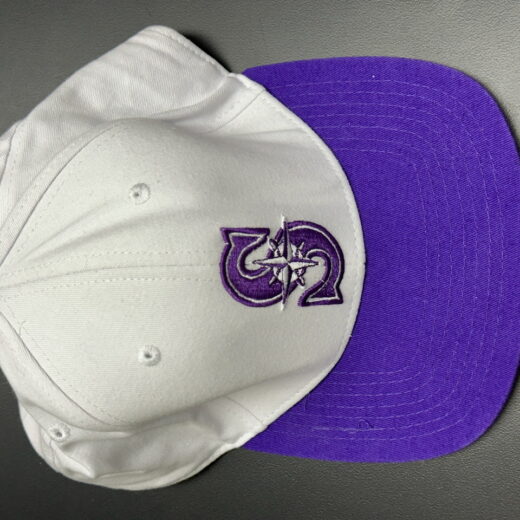 White and purple University of Washington snapback hat with Mariners-inspired compass logo and W Alumni embroidery
