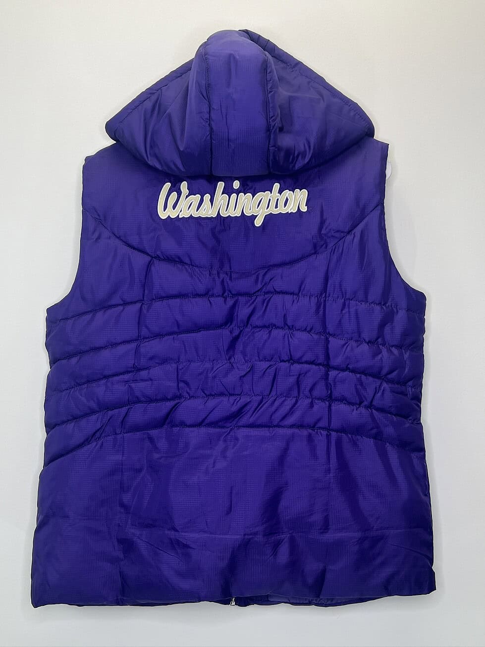 Back of vest with stitched “Washington” lettering and hood