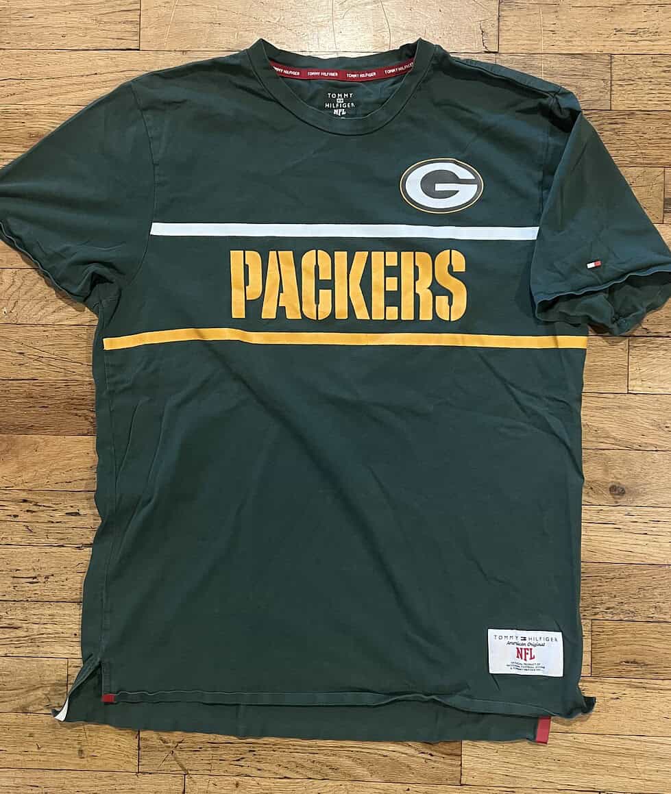 Front view of Tommy Hilfiger Green Bay Packers NFL tee with team logo and stripe design