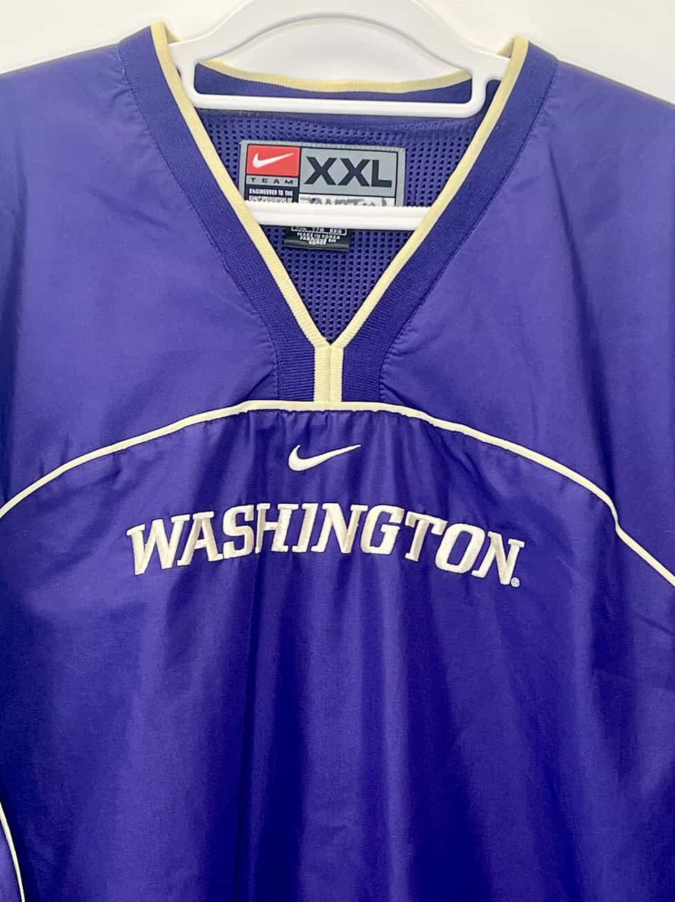 Close-up of Nike Team label and Washington embroidery on vintage Huskies pullover