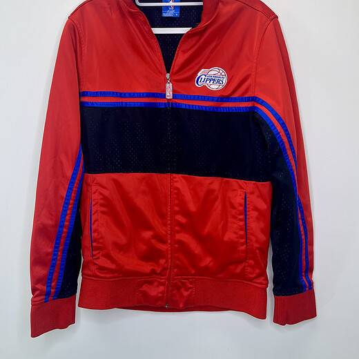 vintage-style Los Angeles Clippers red and black zip-up jacket with blue accents, NBA logo zipper pull, and mesh detailing.