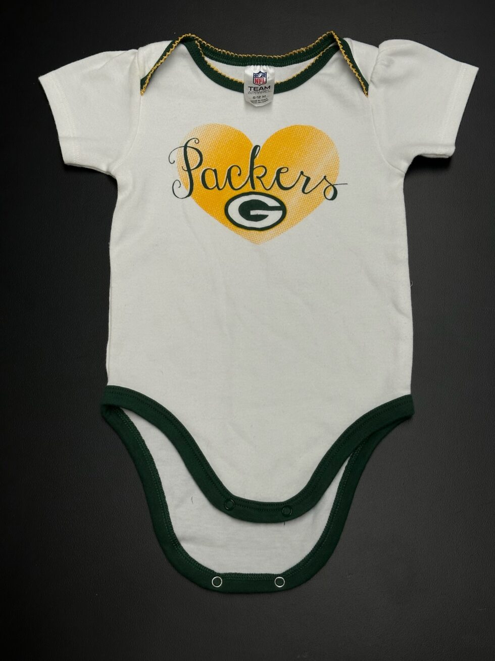 Front of Green Bay Packers baby onesie with gold heart and “Packers” text, size 6–12 months