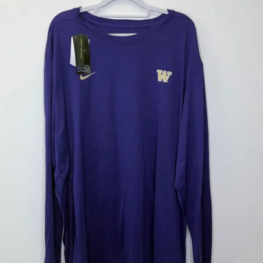 Front views of a purple Nike Dri-FIT long sleeve shirt featuring the Washington Huskies "W" logo and official on-field apparel tags.