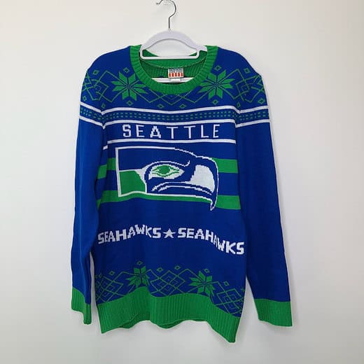 Front view of Seattle Seahawks holiday sweater by Junk Food in size XL with team logo and festive green snowflake accents