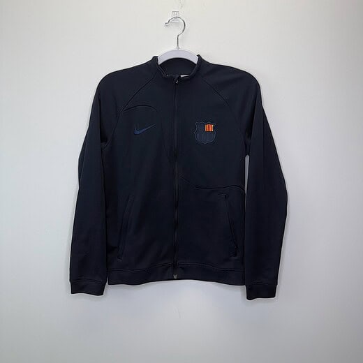 navy FC Barcelona youth Nike track jacket with embroidered crest and slim-fit design